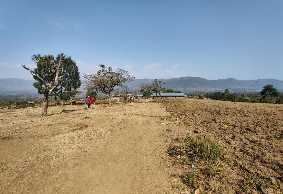 School and water point in the background of photo